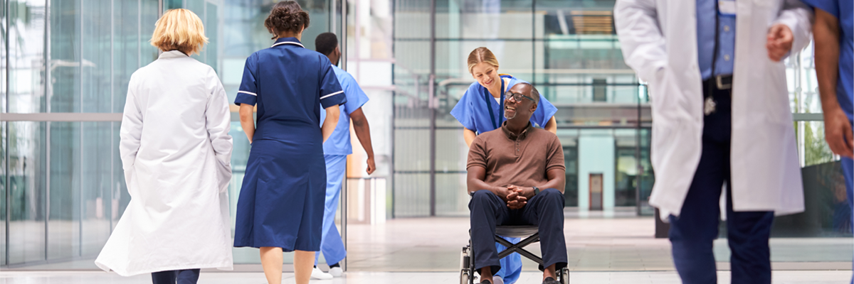  female-nurse-wheeling-patient-header-1200x400